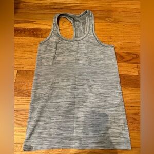 Perfect condition Lululemon top. Light gray, with a green undertone.